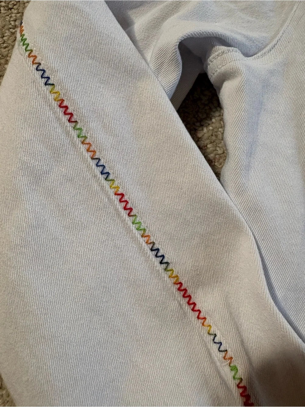 Coco + Carmen Women’s White Denim Jacket with Rainbow Stitching